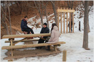 Photograph of Physical Experience Zone and picnic tables
