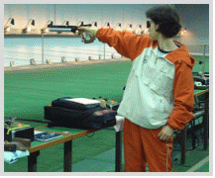 Photograph of an athlete aiming at a target